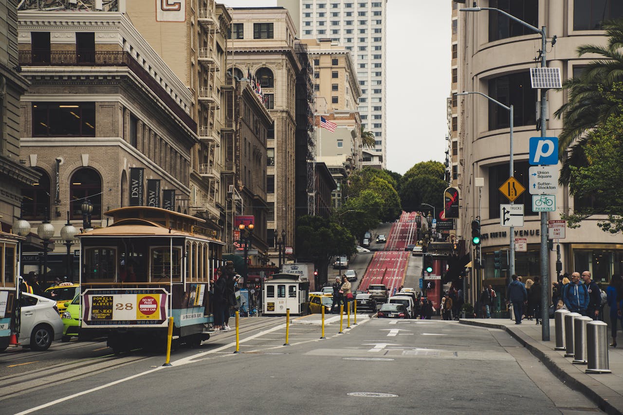 A tram traveling along a busy city street.